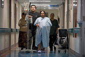 Canadian Healthcare / Toronto, Canada.

Supported by her husband Bala Gnanam and their mothers, mother-to-be Nimanthika Kaneira walks the birthing unit corridor to hasten her labour.