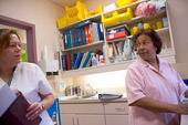 Canadian Healthcare / Toronto, Canada.

Palliative Care Unit nurse Saras Moodley-Fitzgerald (pink uniform) warns co-worker Nancy Gall of the sudden decline of one of their patients.