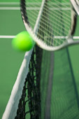 tennis racket, ball and net