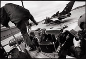 A German Tornado ground crewman helps his pilot buckle up in preparation for a low-level training mission over Nitassinan/Labrador, Canadian Forces Base Goose Bay, Nitassinan/Labrador.
